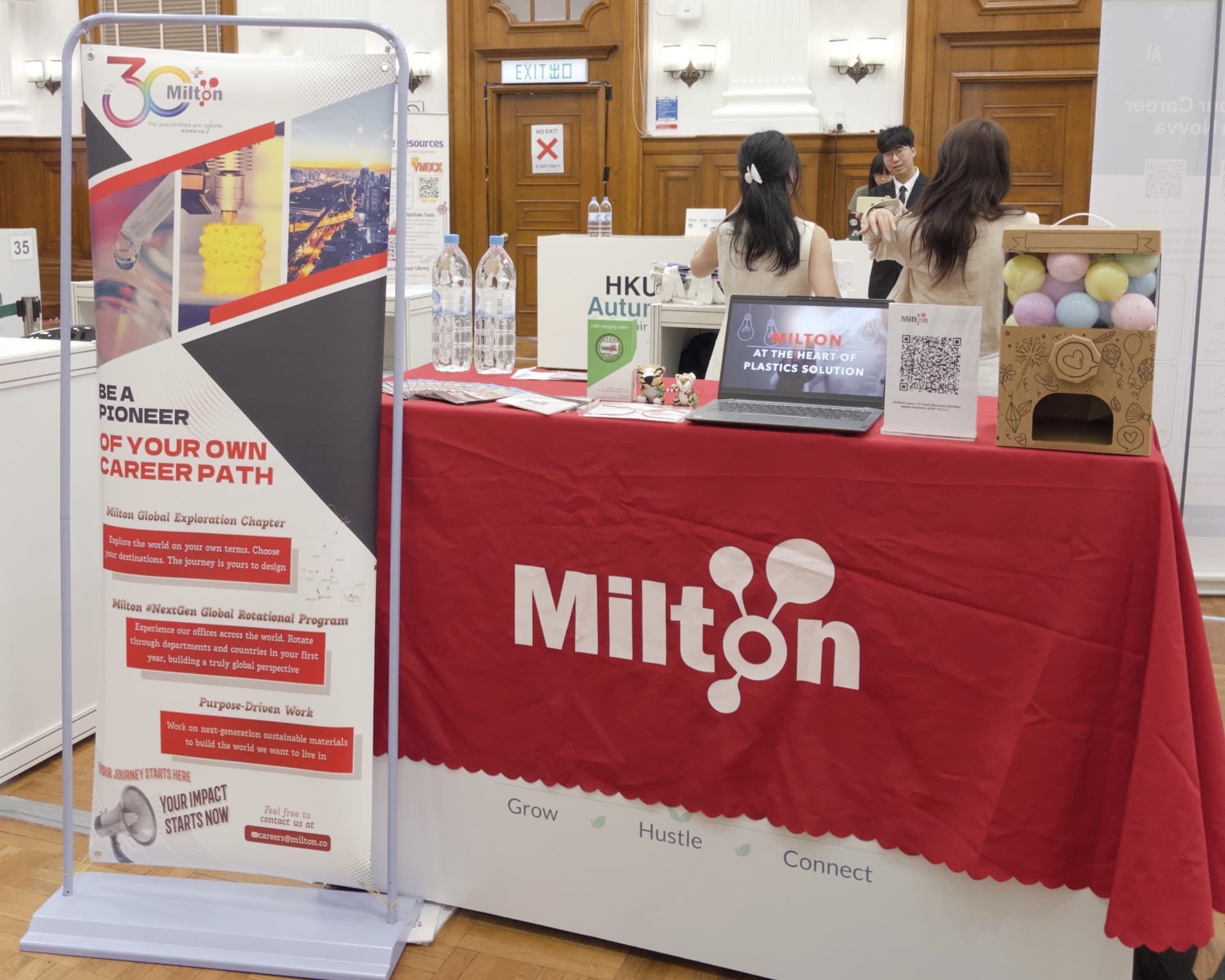 The Milton booth at the HKU Autumn Career Fair 2026, with the careers banner and recruitment materials